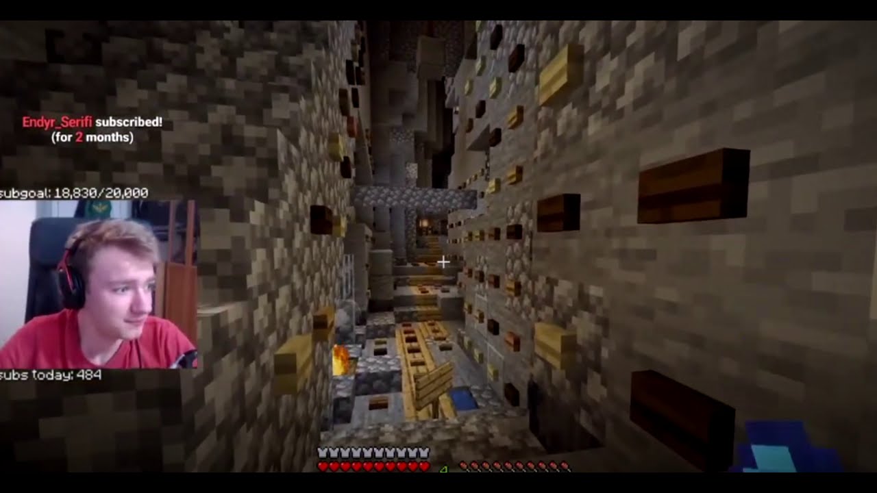 A screenshot of Tommy's stream. It shows the ravine of Pogtopia and every block has a button on it of somekind. Even the floor has buttons.
